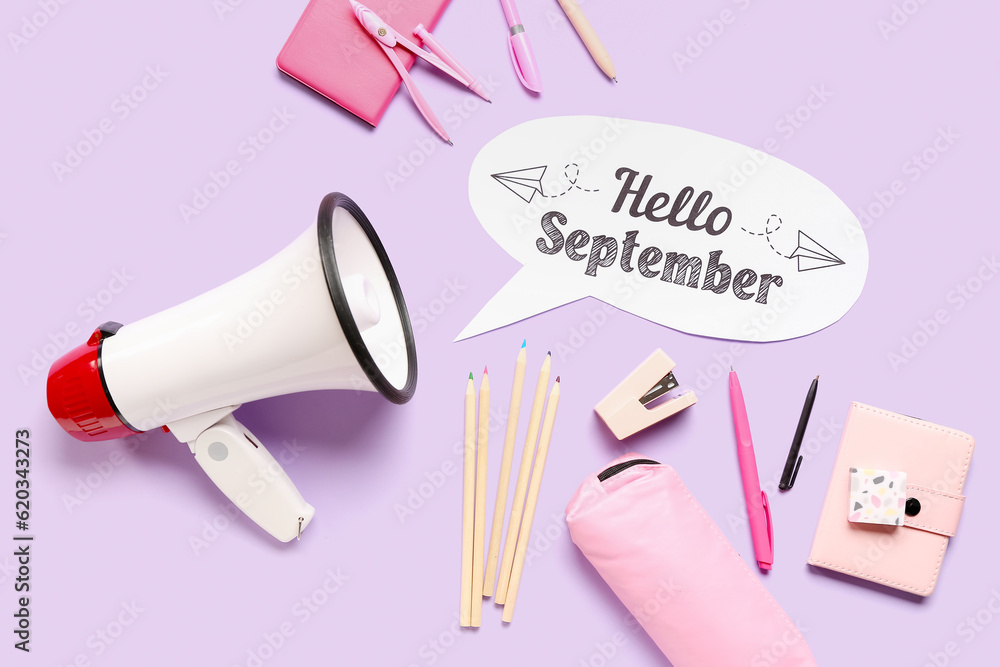 Different stationery, megaphone and speech bubble with text HELLO SEPTEMBER on lilac background