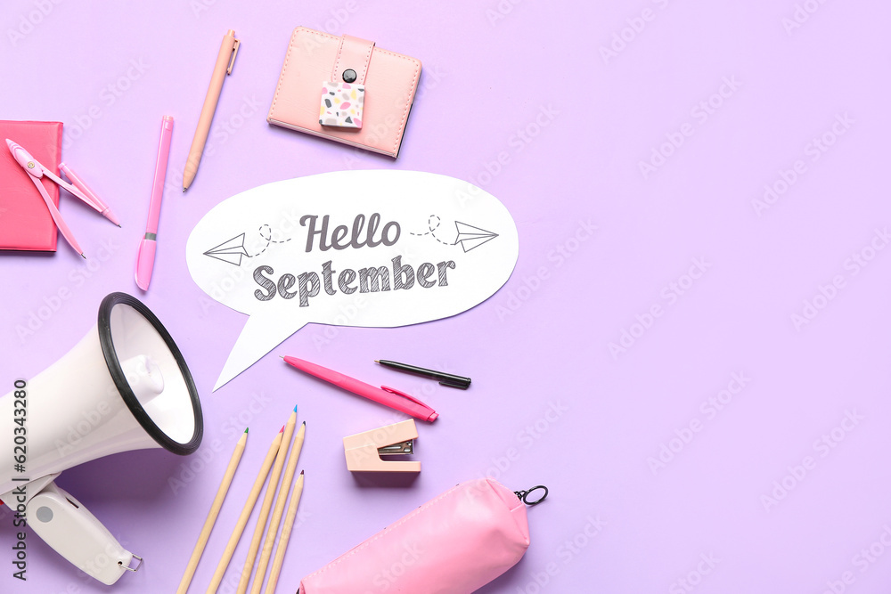 Different stationery, megaphone and speech bubble with text HELLO SEPTEMBER on lilac background