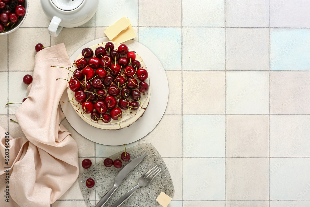 Tasty cherry cake on white tile background