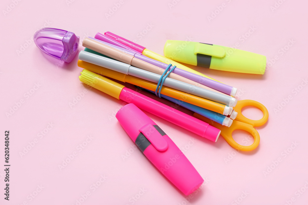 Stationery in shape of rocket on pink background