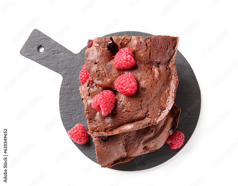 Board with pieces of raspberry chocolate brownie on white background