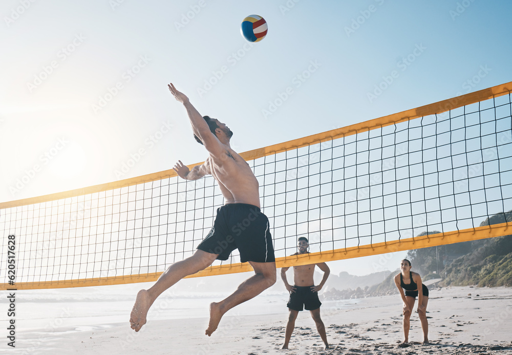 Man, jump and volleyball in air on beach by net in sports match, game or competition. Body of male p