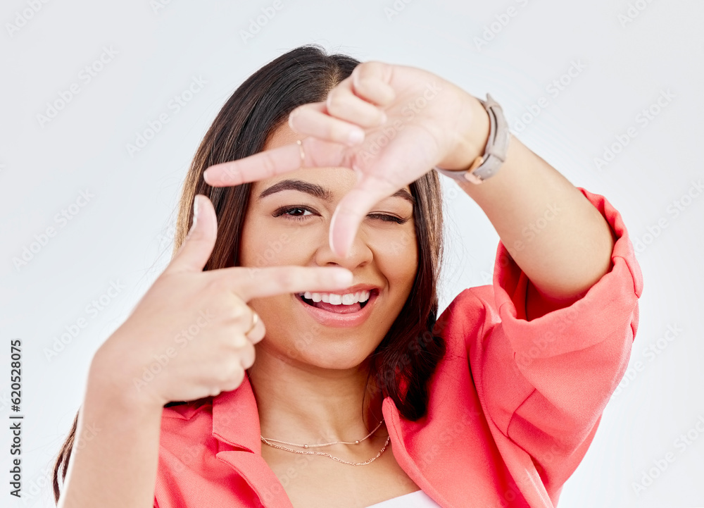 Happy, portrait of a woman with hand frame and against a white background. Social media or creativit