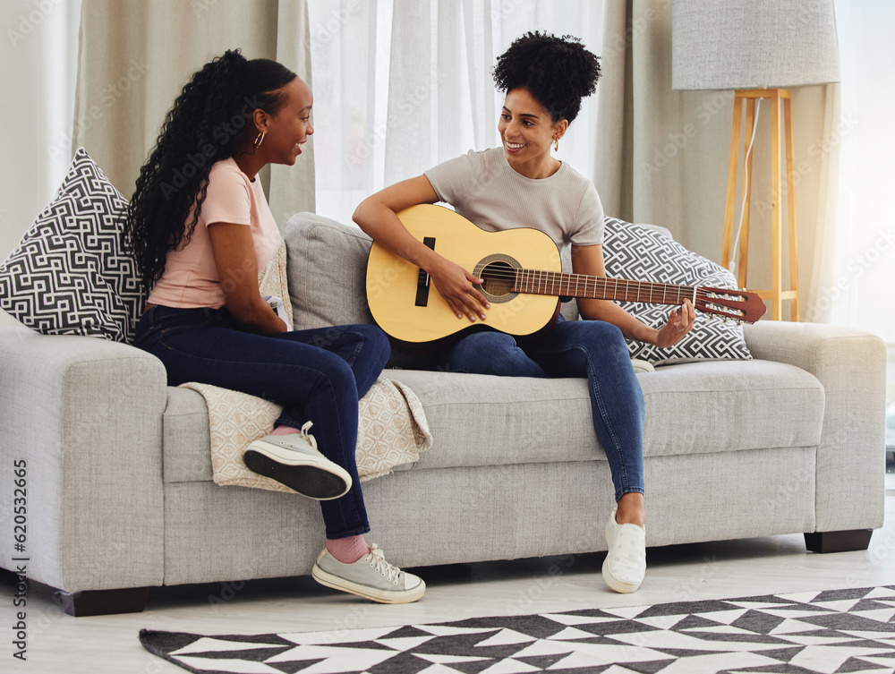 Guitar, happy or women in house for music, social or entertainment while laughing together on sofa. 