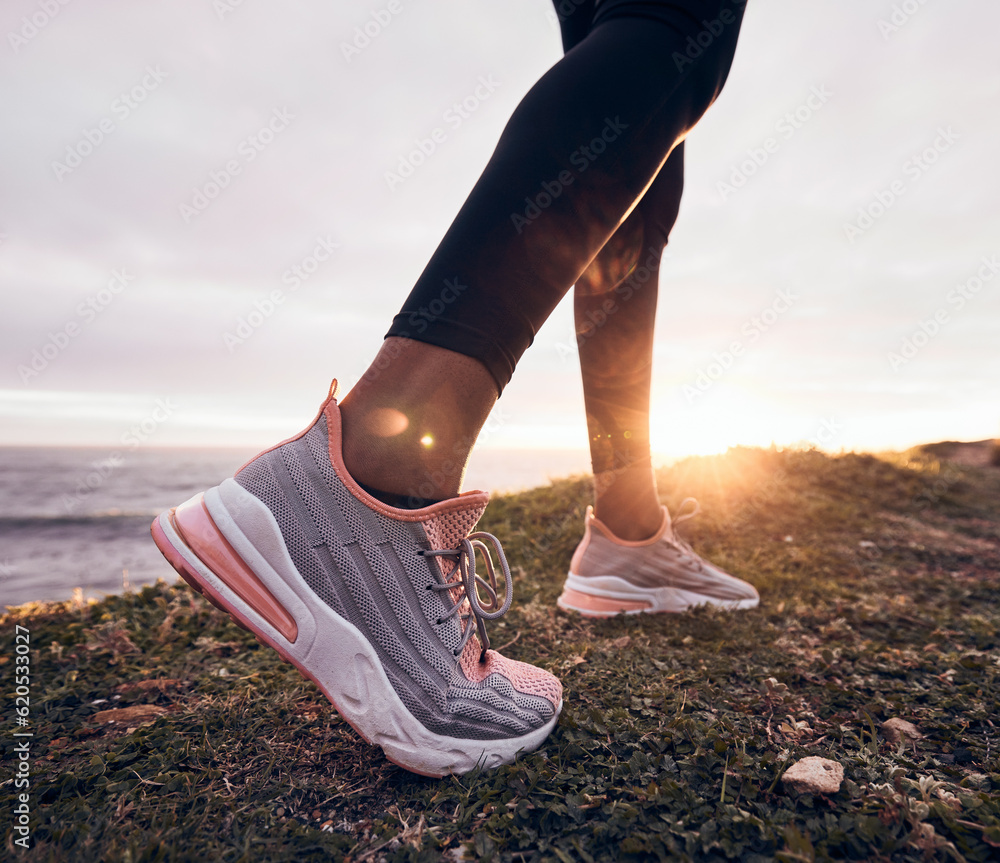 Shoes, closeup and beach ground for fitness, workout and training to start a run. Outdoor, sunset an