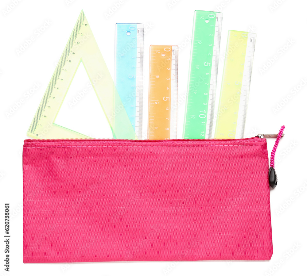 Colorful rulers and pencil case on white background