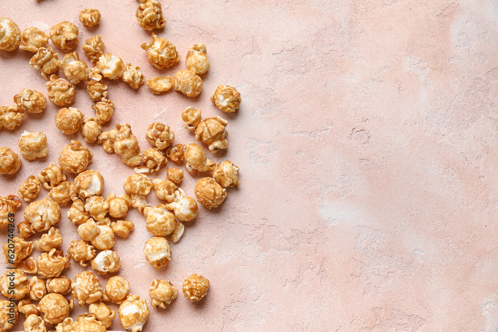 Tasty popcorn on pink background