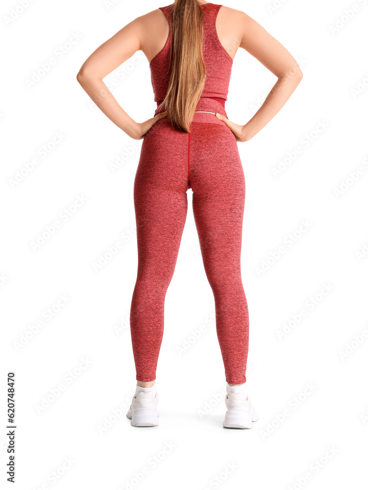 Young woman in sportswear on white background, back view