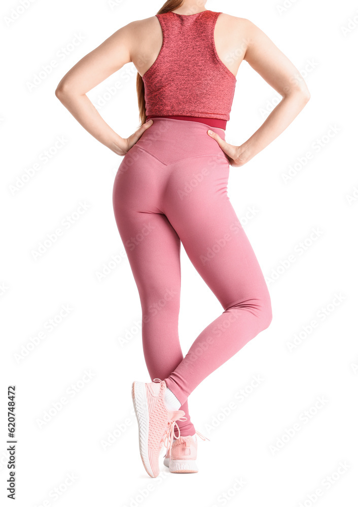 Young woman in sportswear on white background, back view