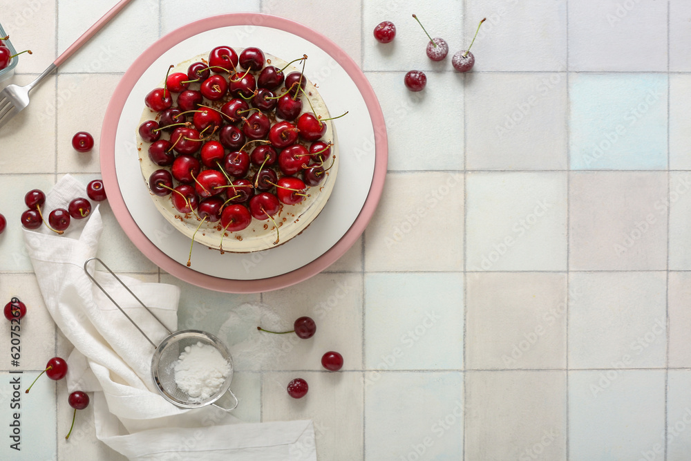 Plate with tasty cherry cake on white tile background