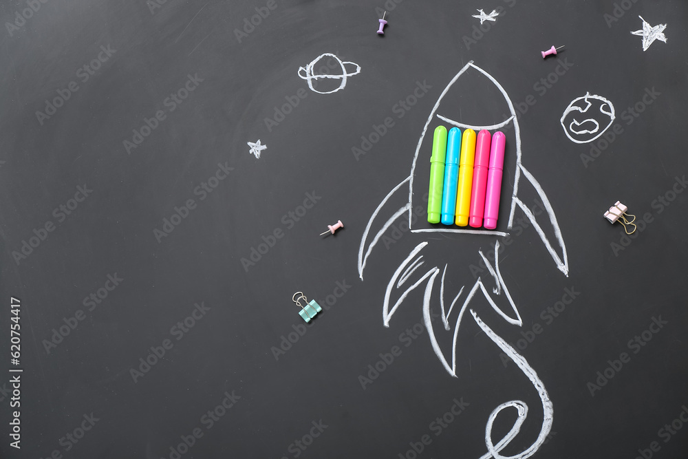 Drawn rocket with markers on black background