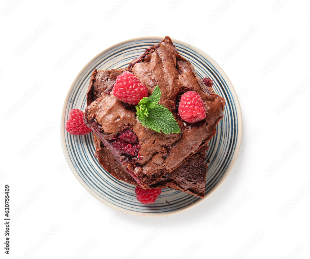 Plate with pieces of raspberry chocolate brownie on white background