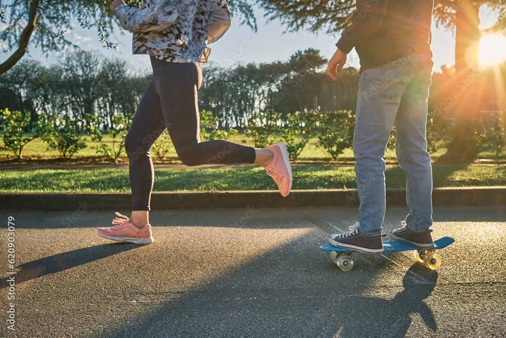 Happy family outdoors, mother and son running, go in sports, Boy rides skateboard, mom runs on sunny