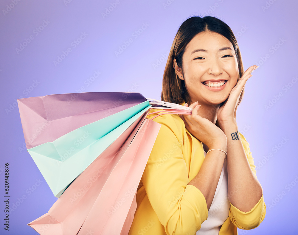 Happy, portrait and woman with shopping bag, retail and commerce with fashion sale on purple backgro