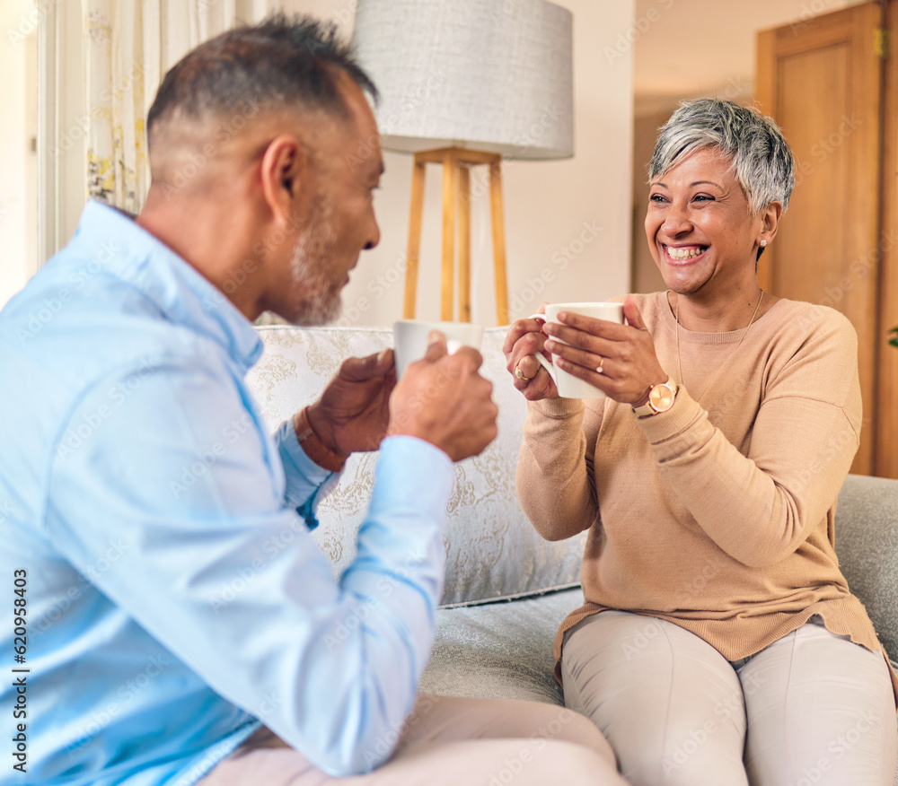 Coffee, retirement and a senior couple on a sofa in the home living room to relax while bonding in c