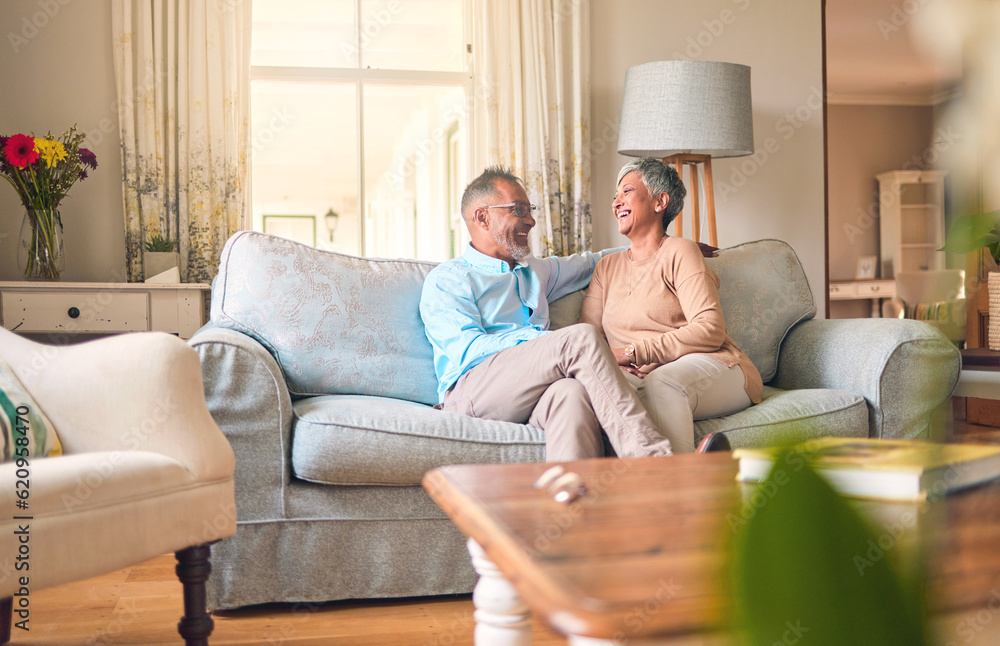 Couch, love and senior couple relax and laugh together in a home for a conversation and bonding on r