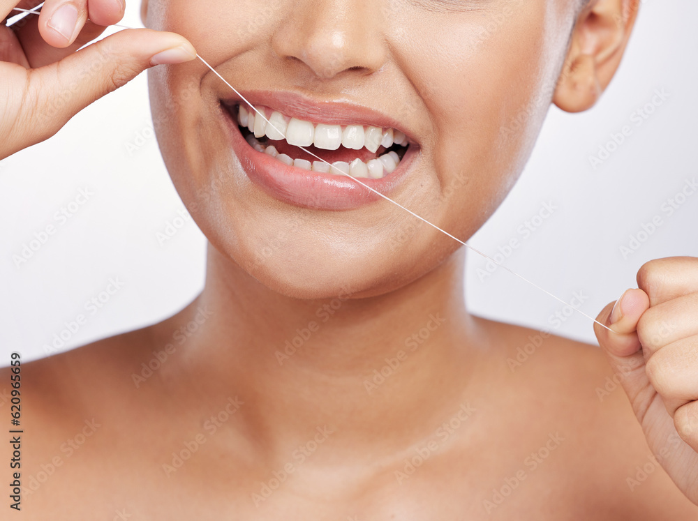 Mouth, face and woman floss teeth for dental health, care or gingivitis on studio background. Closeu