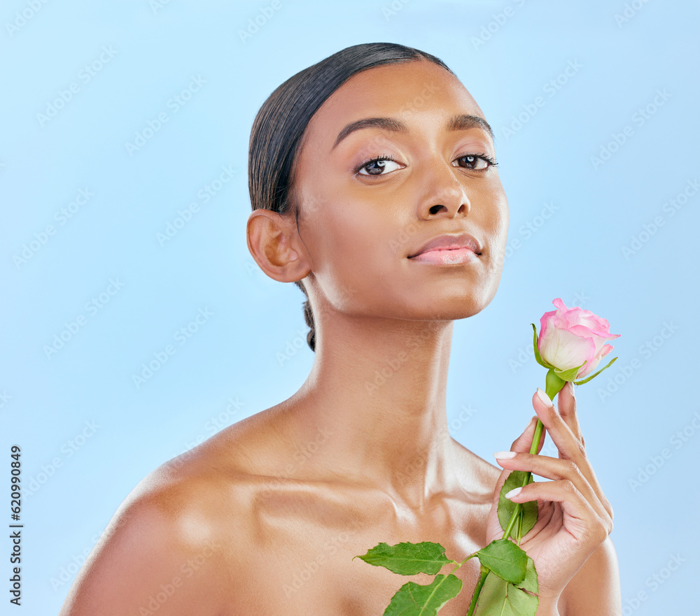 Woman, skincare and rose with natural beauty, portrait and eco friendly dermatology on blue backgrou