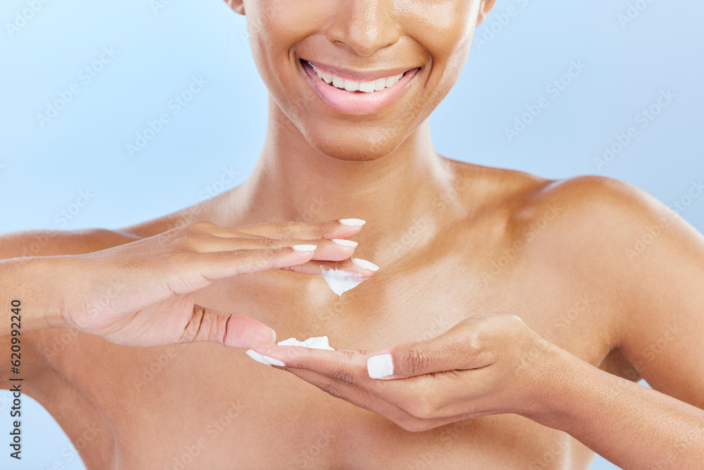 Closeup, woman and cosmetics with cream, hands and dermatology against a blue studio background. Zoo