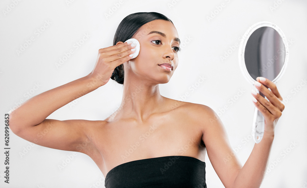 Woman, mirror and cotton pad for face, cosmetics and aesthetic skincare in studio on white backgroun