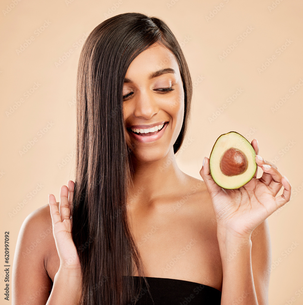 Smile, woman and avocado for hair care, beauty or cosmetic treatment of natural growth on studio bac