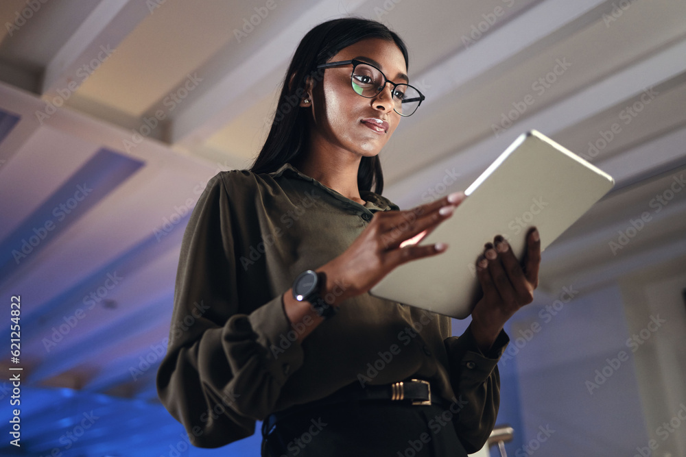 Work, night or woman reading on tablet for research, project or planning a proposal in office buildi