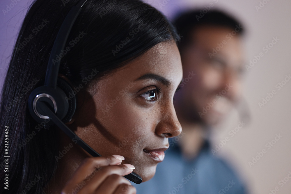 Woman, call center and headphones at night in customer service, support or telemarketing at the offi