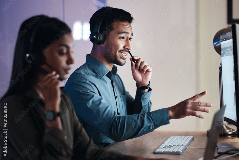 Man, call center and headphones at night in customer service, support or telemarketing at the office