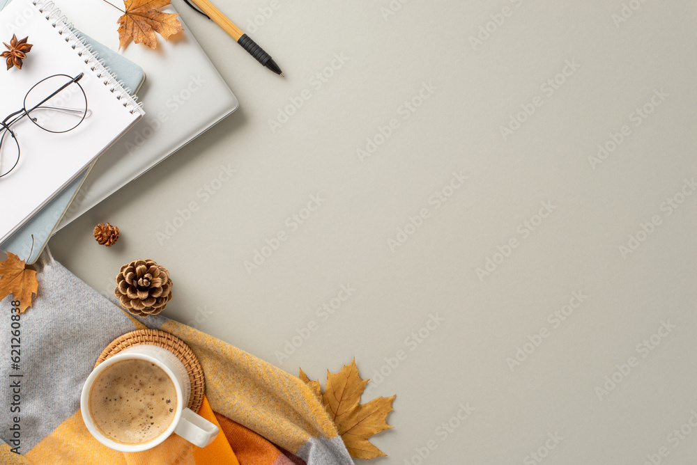 Autumn season business concept. Top view of laptop, notepads, spectacles, cup of fresh coffee, cozy 