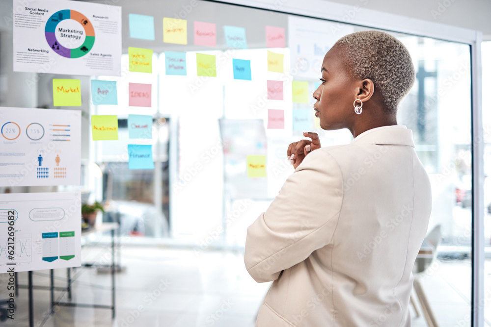 Black woman, thinking and glass board for project management, marketing or planning at office. Afric