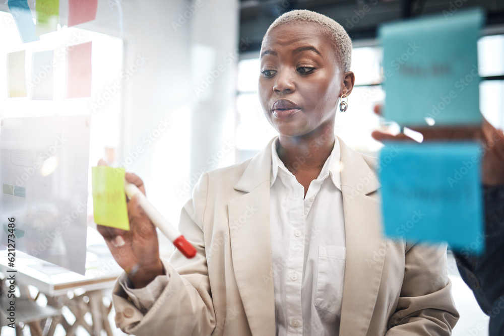 Black woman, sticky note and schedule planning for brainstorming, teamwork or tasks at the office. A