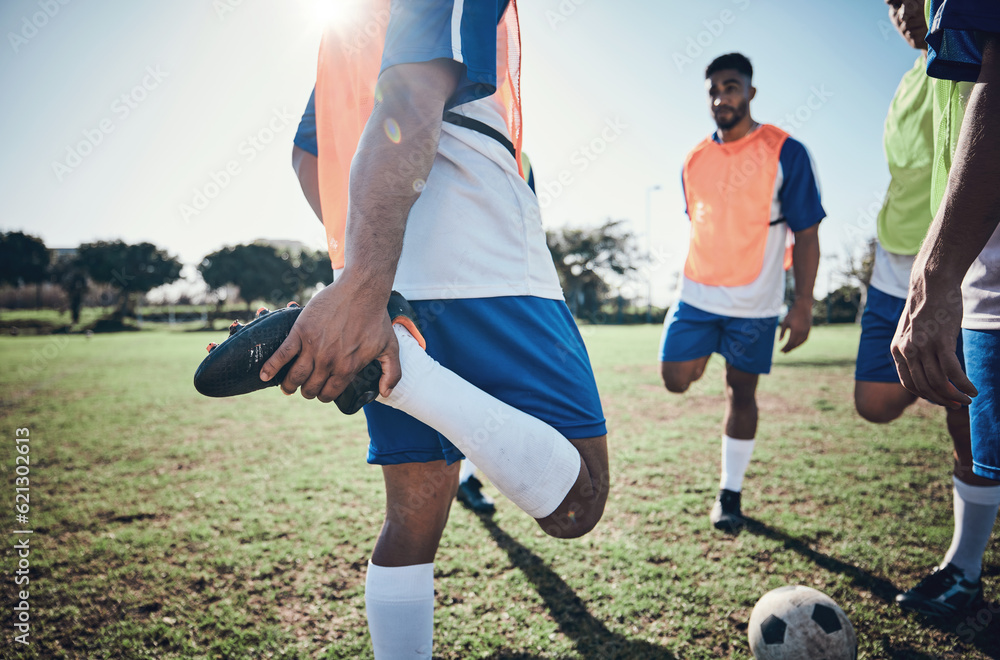 Football player, stretching legs and men training on a field for sports game and fitness. Male socce