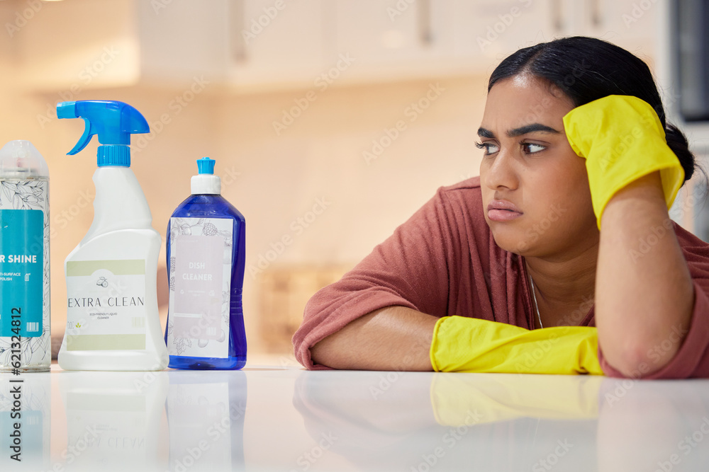 Cleaning, spray bottle and frown with an annoyed woman housekeeper looking at hygiene products in th