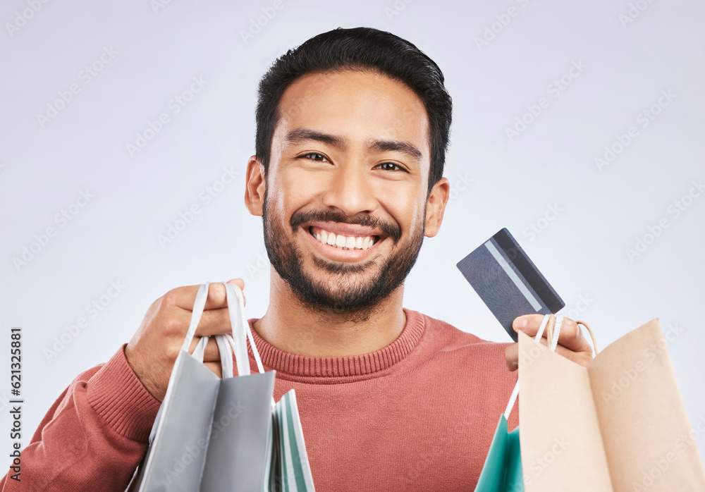 Shopping bag, portrait and man with happiness, credit card and smile for retail fashion spree, sales