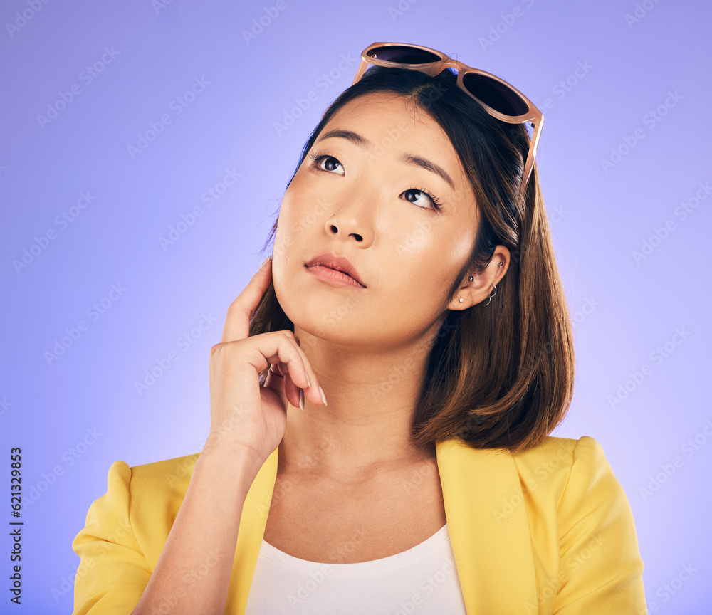 Decision, idea and asian woman with wonder or choice with purple background in studio with glasses. 