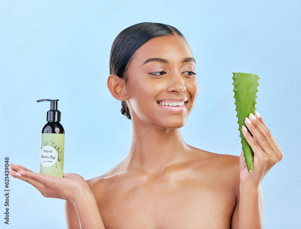 Woman, aloe vera and skincare in studio with smile, natural choice and happy by blue background. Gir