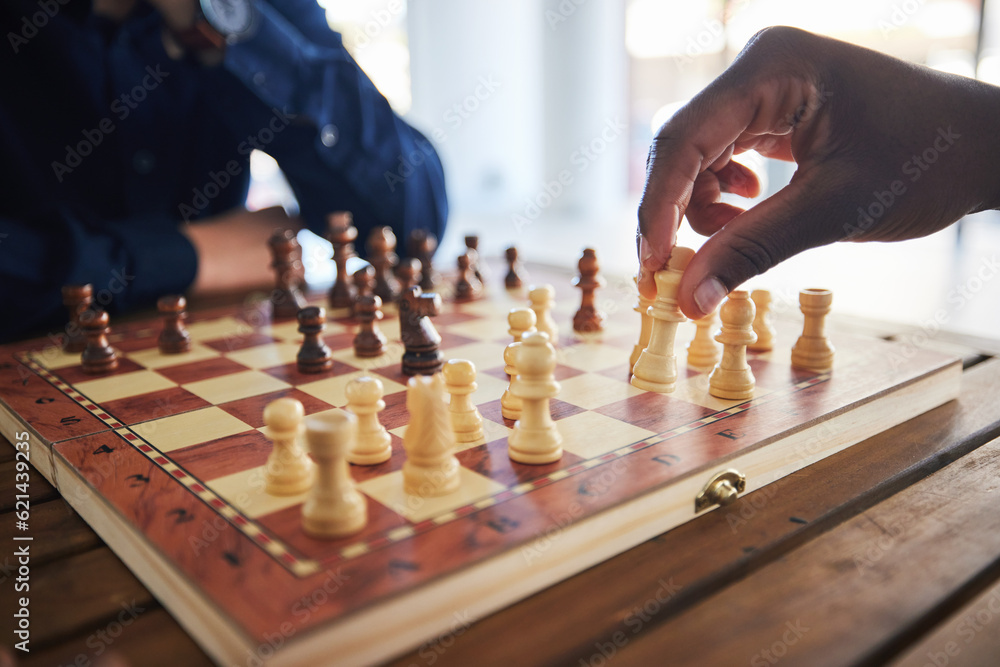 Hands, fun and people with a chess game, strategy and playing together at a competition. Table, prof