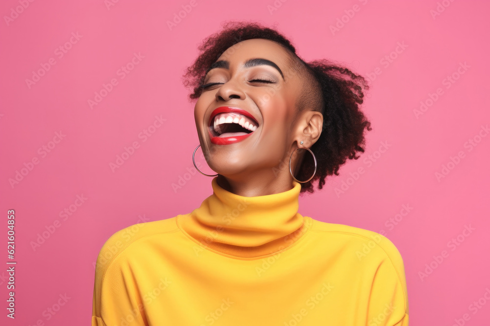 Happy African American woman on pink background.