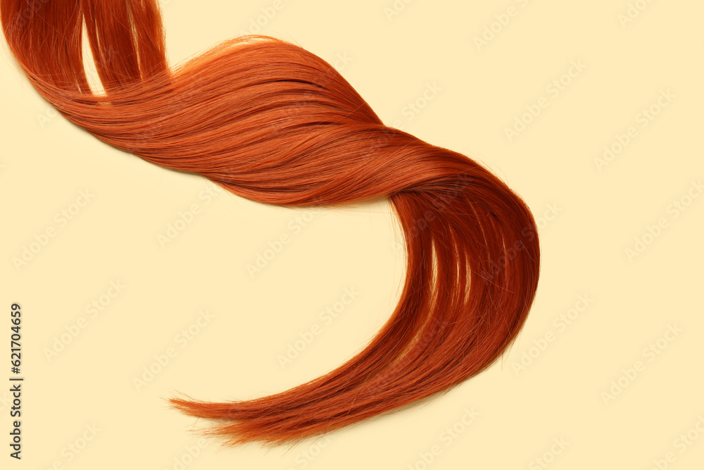 Ginger hair strand on color background, closeup