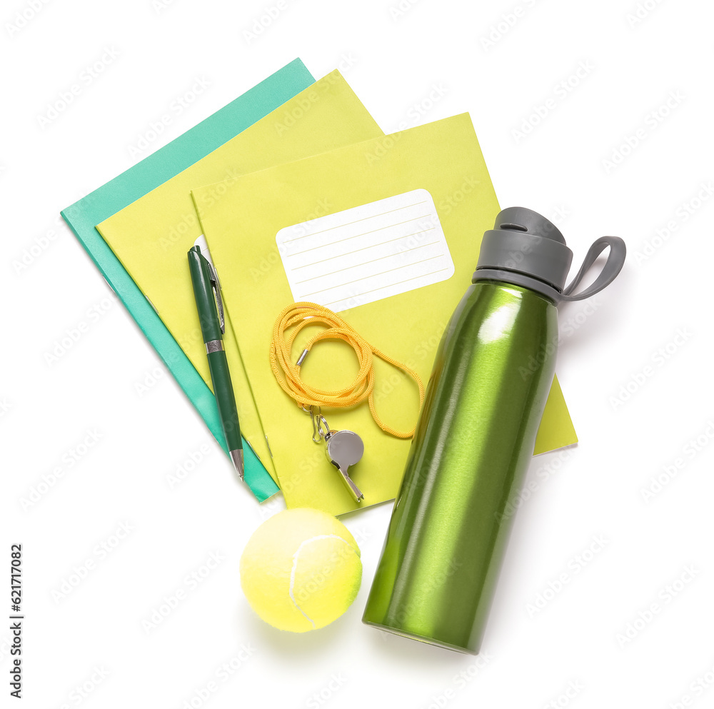 Bottle of water with tennis ball, whistle and stationery isolated on white background