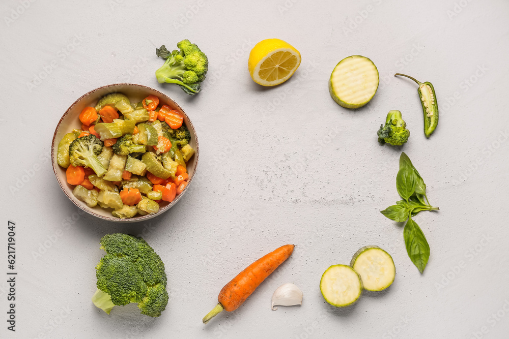 Frame made of fried and fresh vegetables on light background