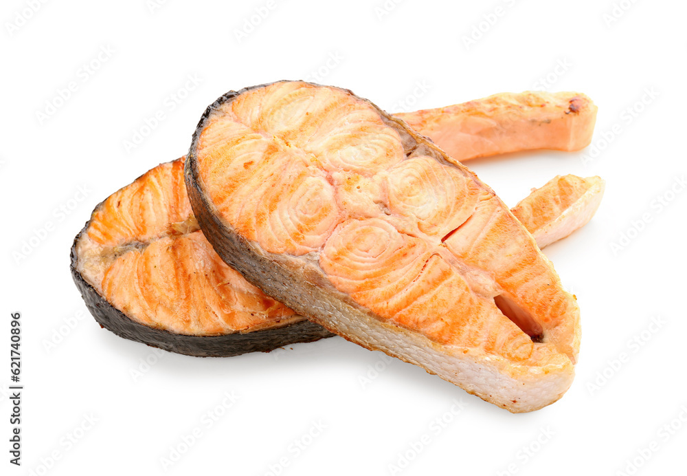 Tasty grilled salmon steaks on white background