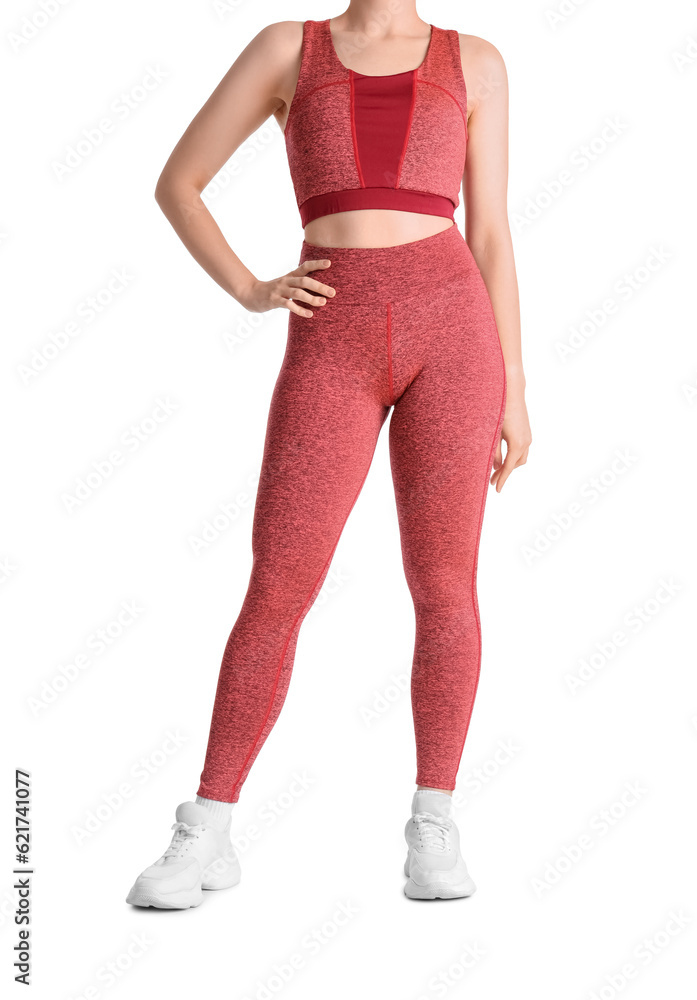 Young woman in sportswear on white background