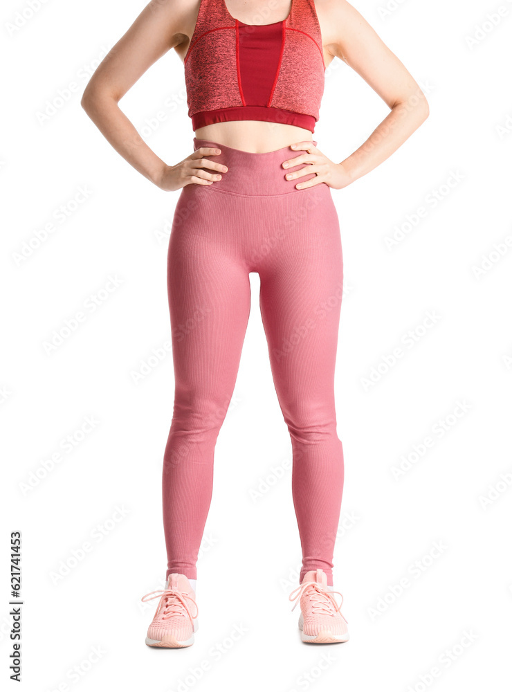 Young woman in sportswear on white background