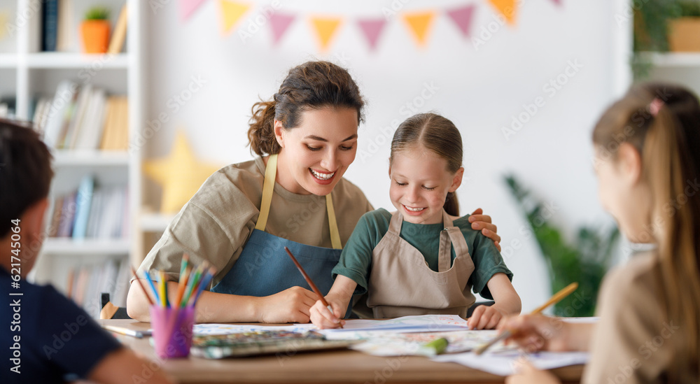 kids and teacher at the art class