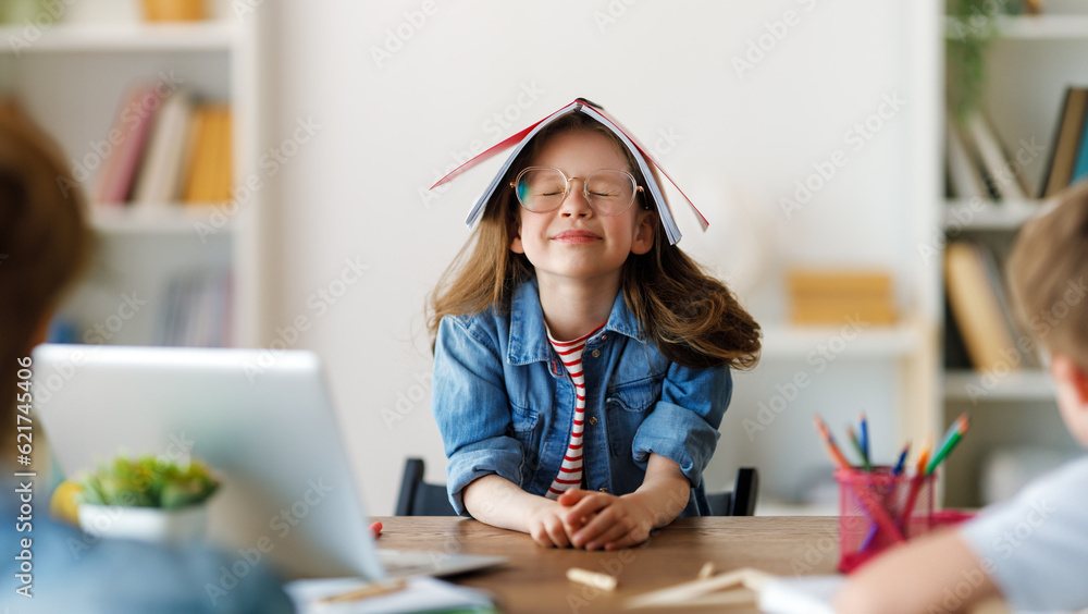 Girl doing homework or online education.