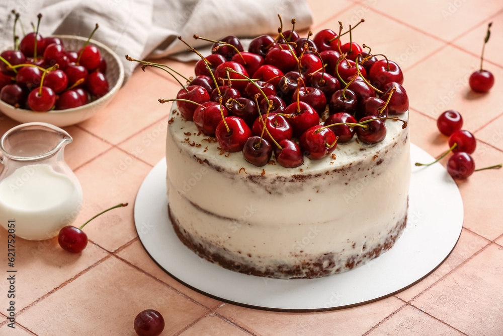 Tasty cherry cake on beige tile background