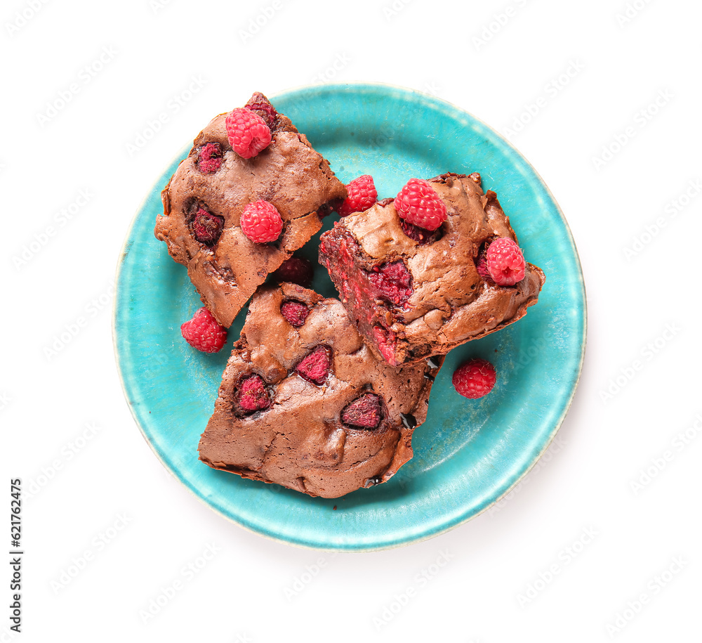 Plate with pieces of raspberry chocolate brownie on white background