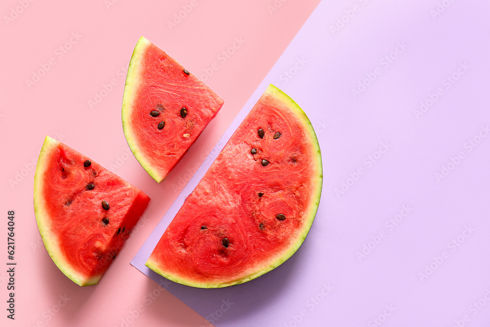 Pieces of fresh watermelon on colorful background