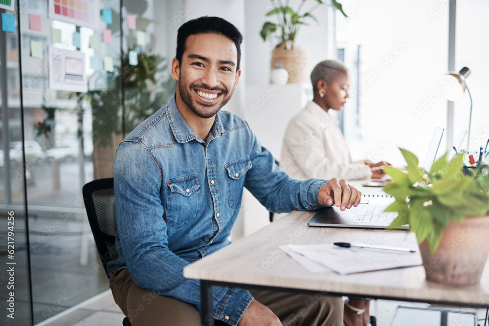 Portrait of happy man at desk in coworking space with laptop, notes and work at design agency. Busin